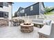 Outdoor patio featuring a fire pit, dining area, and built-in concrete benches at 3858 W 117Th Ct, Westminster, CO 80031
