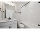 Bathroom features white tile, black hardware, and a shower-tub combination at 1269 Penner Dr, Erie, CO 80026