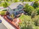 Stunning aerial view showcasing a landscaped backyard with a deck, hot tub, and lush green space at 4467 Trailside Ln, Castle Rock, CO 80109