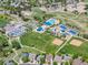 Aerial view of community park with tennis courts, baseball fields, playground, and pool at 4467 Trailside Ln, Castle Rock, CO 80109