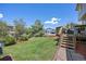 Expansive backyard with well-maintained lawn and wooden deck, perfect for outdoor activities and gatherings at 4467 Trailside Ln, Castle Rock, CO 80109