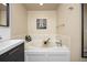 Relaxing bathroom featuring soaking tub and tiled backsplash at 4467 Trailside Ln, Castle Rock, CO 80109