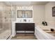 Elegant bathroom with a double sink vanity, a soaking tub, and a separate glass shower at 4467 Trailside Ln, Castle Rock, CO 80109