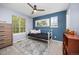 Charming bedroom with a daybed, rug, and a view of lush greenery through the window at 4467 Trailside Ln, Castle Rock, CO 80109