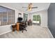 Bedroom with a desk area, sliding glass doors to the outside, and neutral colored walls at 4467 Trailside Ln, Castle Rock, CO 80109