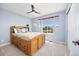 Cozy bedroom with wood bed frame with storage and natural light from a large window at 4467 Trailside Ln, Castle Rock, CO 80109