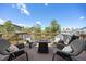Relaxing deck area with comfortable seating around a cozy fire pit at 4467 Trailside Ln, Castle Rock, CO 80109