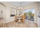 Dining area features a round table, wood chairs, and a sliding glass door to a deck at 4467 Trailside Ln, Castle Rock, CO 80109