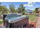 Inviting backyard hot tub surrounded by lush landscaping, ideal for relaxation and entertaining guests at 4467 Trailside Ln, Castle Rock, CO 80109