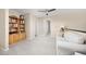 Comfortable loft area with a bookshelf, seating, and neutral decor at 4467 Trailside Ln, Castle Rock, CO 80109