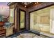 Outdoor patio features a grill and glass doors offering views into the interior living spaces at 6396 Nelson Ct, Arvada, CO 80004