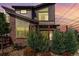 Striking architectural design showcasing modern brick and siding exterior with decorative plantings at 6396 Nelson Ct, Arvada, CO 80004