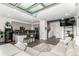 Open living space with modern kitchen, living area with sectional sofa, and contemporary design elements at 6396 Nelson Ct, Arvada, CO 80004
