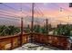 Charming rooftop patio with string lights, wood railings, and scenic views at 6396 Nelson Ct, Arvada, CO 80004