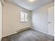 Well-lit bedroom with carpet, window, and a closet at 11860 Harrison St, Thornton, CO 80233