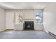 Living room featuring a fireplace and carpet at 11860 Harrison St, Thornton, CO 80233