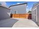 Concrete patio and gated fence in backyard at 338 Mt Wilson St, Brighton, CO 80601