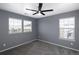 Empty bedroom with neutral walls, carpet, and multiple windows for natural light, ready for personalization at 338 Mt Wilson St, Brighton, CO 80601