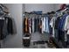 Walk-in closet with organized shelving and hanging space, maximizing storage in a compact design at 338 Mt Wilson St, Brighton, CO 80601