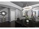 Inviting dining room showcasing dark wood furniture and an open view to the living room at 338 Mt Wilson St, Brighton, CO 80601