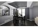 Elegant dining room with a modern chandelier and direct view into the living room at 338 Mt Wilson St, Brighton, CO 80601