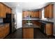 Charming kitchen with stainless steel appliances and dark countertops at 338 Mt Wilson St, Brighton, CO 80601