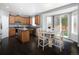 Well-lit kitchen with wood cabinets, stainless steel appliances, and an island at 338 Mt Wilson St, Brighton, CO 80601