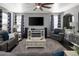 Inviting living room featuring a large television, fireplace, and comfortable seating at 338 Mt Wilson St, Brighton, CO 80601