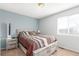 Bedroom with full sized bed, end tables and closet at 17665 E Temple Dr, Aurora, CO 80015