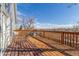 A spacious wood deck provides an elevated outdoor living space with great views of the neighborhood at 17665 E Temple Dr, Aurora, CO 80015