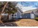 View of home with small, quaint front porch and garden at 17665 E Temple Dr, Aurora, CO 80015