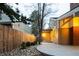 Exterior view of the house with a fenced yard and a stone paved patio area at 7743 S Jersey Way, Centennial, CO 80112