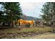 Backyard view with a creek running through the community and a wood fence at 7743 S Jersey Way, Centennial, CO 80112