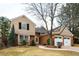 Charming two-story home with a brick facade, attached two car garage, and beautifully landscaped front yard at 7743 S Jersey Way, Centennial, CO 80112