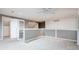 Upstairs hallway with neutral paint and carpet with easy access to storage at 7743 S Jersey Way, Centennial, CO 80112