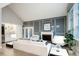 Elegant living room with a fireplace, custom wall paneling, and view into the dining area at 7743 S Jersey Way, Centennial, CO 80112