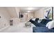 Finished basement featuring a living room area with neutral paint and carpet at 7743 S Jersey Way, Centennial, CO 80112