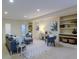 Finished basement with built-in shelving and comfortable seating at 449 Meadow View Pkwy, Erie, CO 80516
