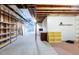 Unfinished basement with shelving and storage at 449 Meadow View Pkwy, Erie, CO 80516
