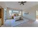 Spacious primary bedroom with high ceilings, large windows, and ample natural light at 449 Meadow View Pkwy, Erie, CO 80516