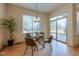 Cozy breakfast nook with a glass table and four chairs at 449 Meadow View Pkwy, Erie, CO 80516