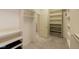 Large walk-in closet with custom shelving and hanging rods at 449 Meadow View Pkwy, Erie, CO 80516