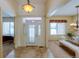 Bright and spacious foyer with tile floors and natural light at 449 Meadow View Pkwy, Erie, CO 80516