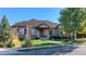 Beautiful ranch home with stone accents and landscaped lawn at 449 Meadow View Pkwy, Erie, CO 80516
