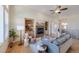 Living room with hardwood floors, fireplace, and open floor plan at 449 Meadow View Pkwy, Erie, CO 80516