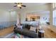 Spacious living area with hardwood floors and kitchen views at 449 Meadow View Pkwy, Erie, CO 80516
