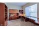 Home office with built-in cabinetry and plenty of workspace at 449 Meadow View Pkwy, Erie, CO 80516