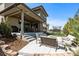 Enjoy the spacious patio with cozy seating, a fire pit, a grill, and a trampoline at 507 Red Thistle Dr, Highlands Ranch, CO 80126