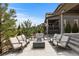 Spacious backyard patio featuring a seating area and fire pit for relaxing outdoor gatherings at 507 Red Thistle Dr, Highlands Ranch, CO 80126