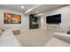 Finished basement boasts a large sectional sofa and entertainment area with bar and media center at 507 Red Thistle Dr, Highlands Ranch, CO 80126